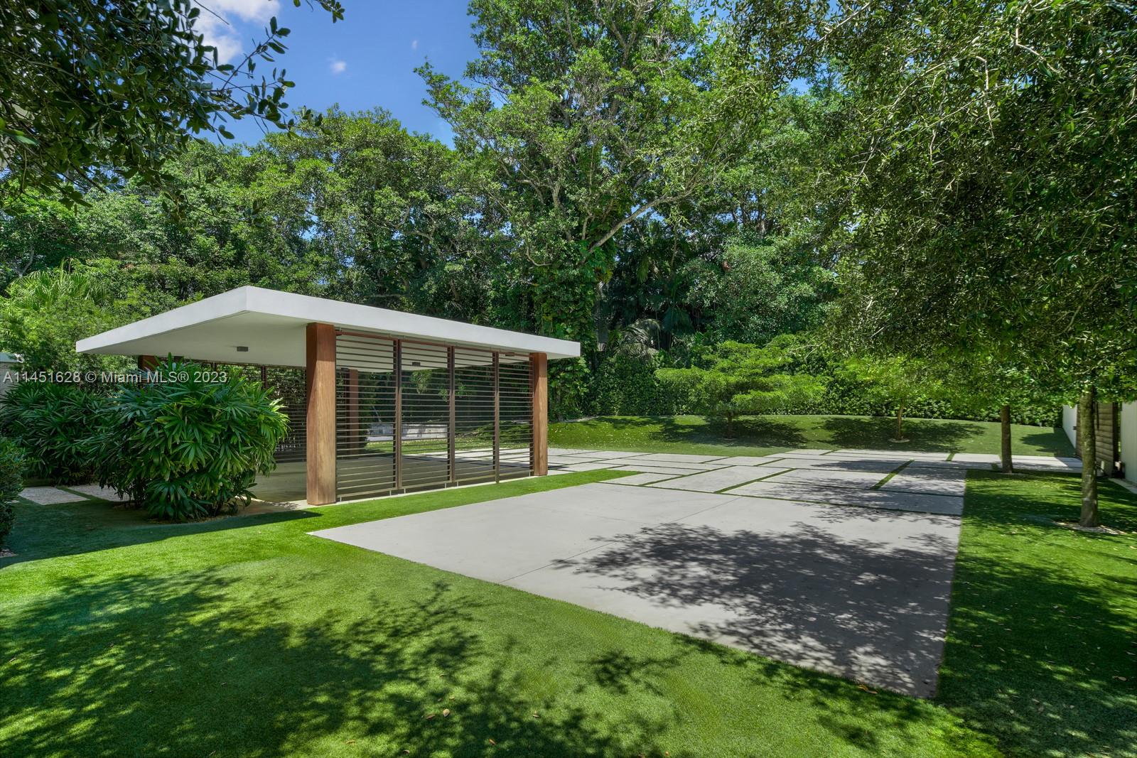 9261 School House Road Coral Gables, FL 33156 - Photo 43 of 65 a view of backyard of house with green space