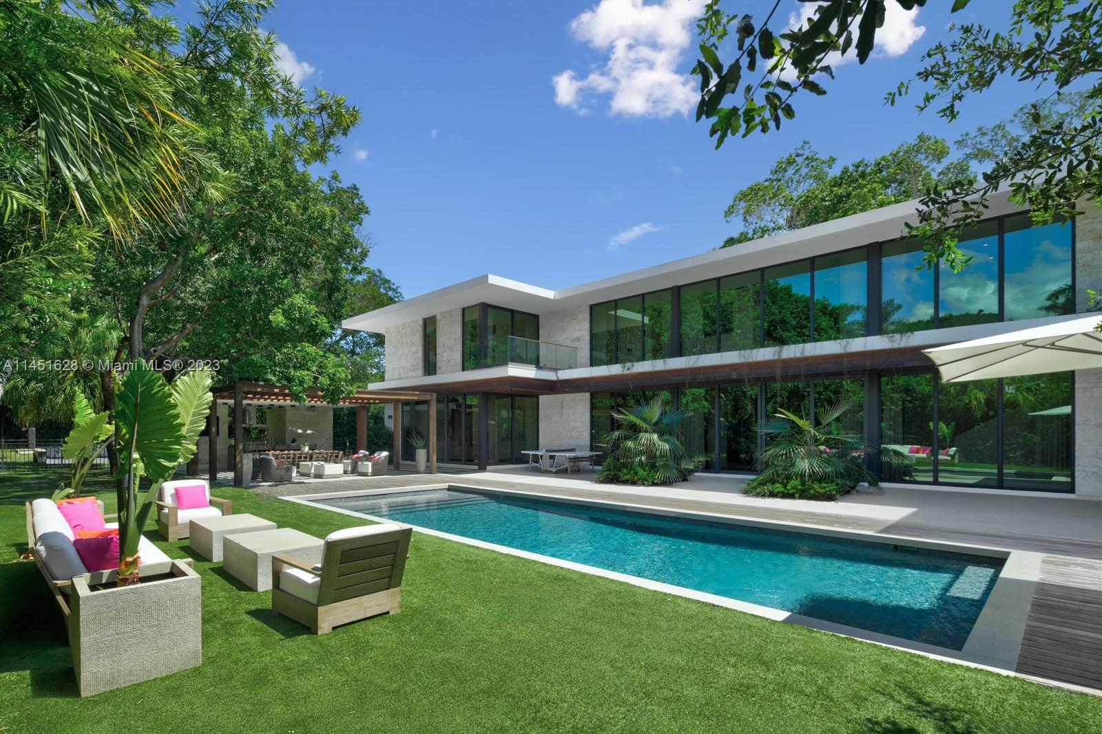 9261 School House Road Coral Gables, FL 33156 - Photo 46 of 65 a house view with a sitting space and garden view