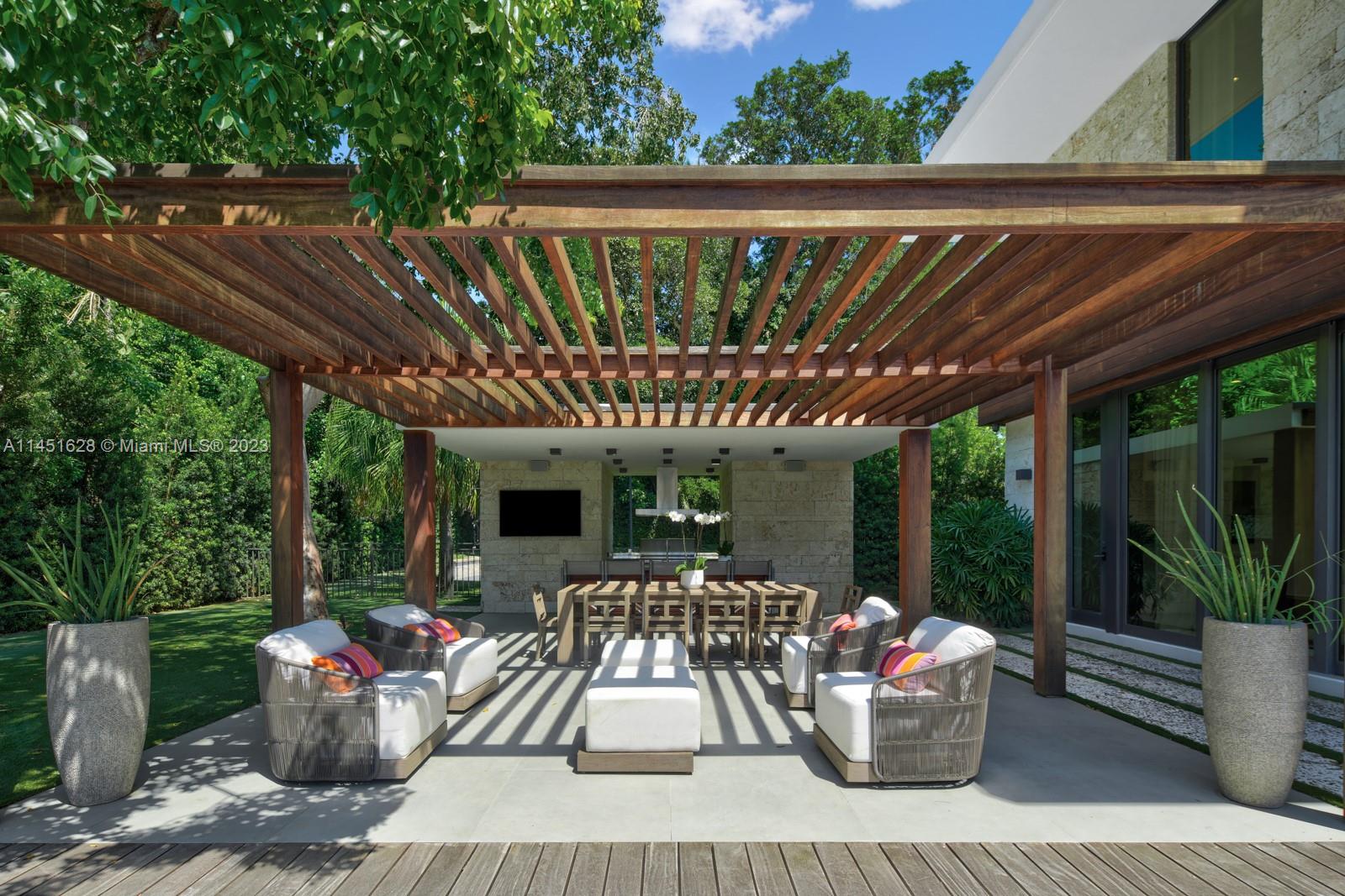 9261 School House Road Coral Gables, FL 33156 - Photo 48 of 65 a patio view with a seating space