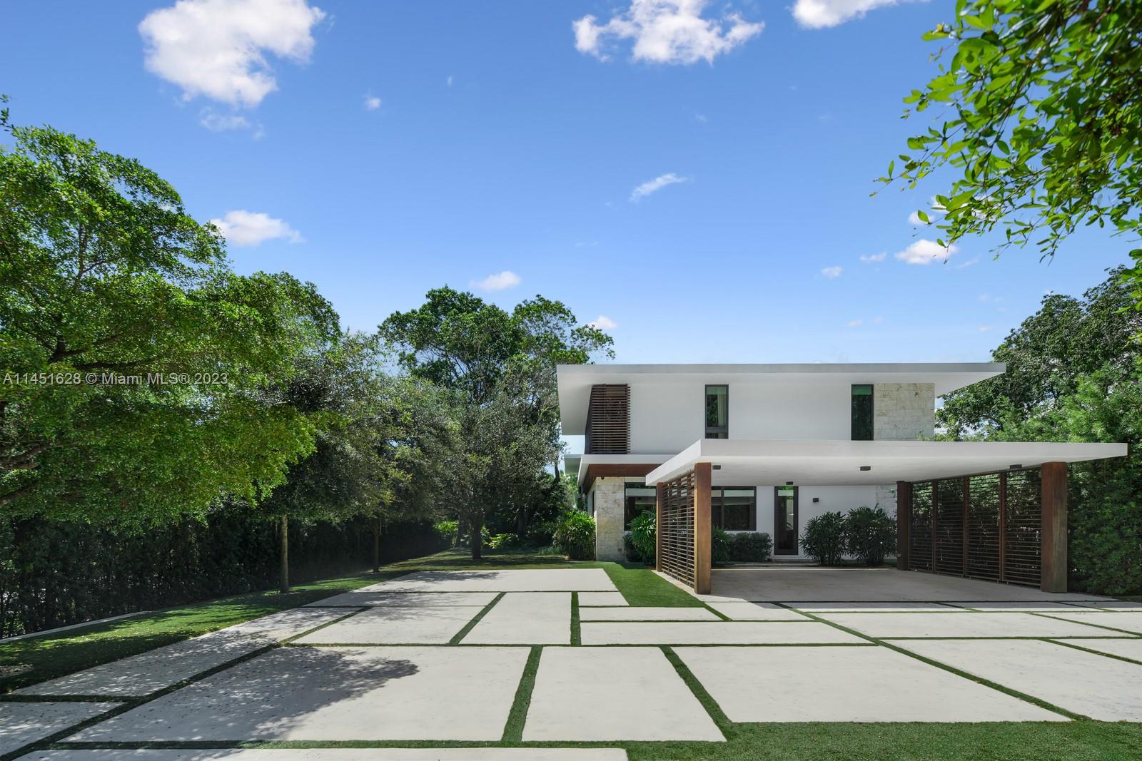 9261 School House Road Coral Gables, FL 33156 - Photo 50 of 65 a view of a patio with chairs and plants