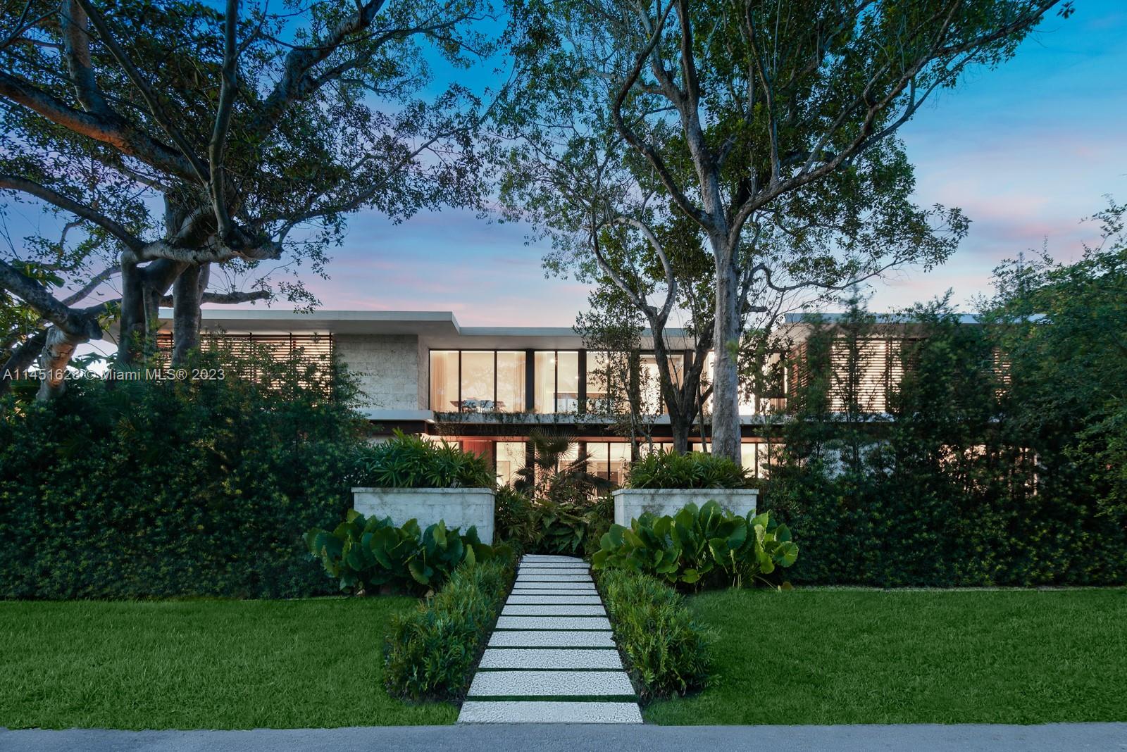 9261 School House Road Coral Gables, FL 33156 - Photo 53 of 65 a front view of a house with yard and green space