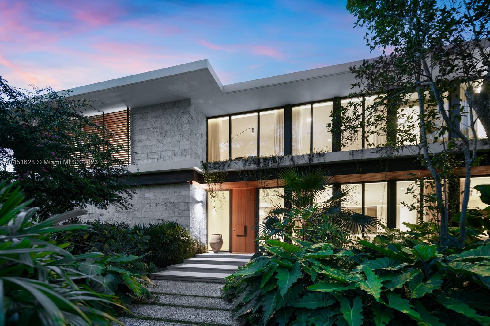 9261 School House Road Coral Gables, FL 33156 - Photo 55 of 65 a front view of a house with a garden