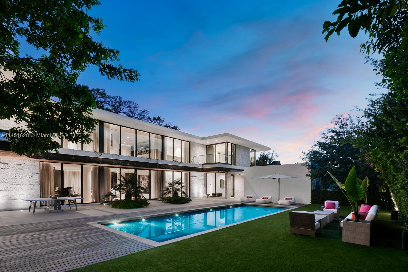 9261 School House Road Coral Gables, FL 33156 - Photo 56 of 65 a view of a house with backyard and sitting area