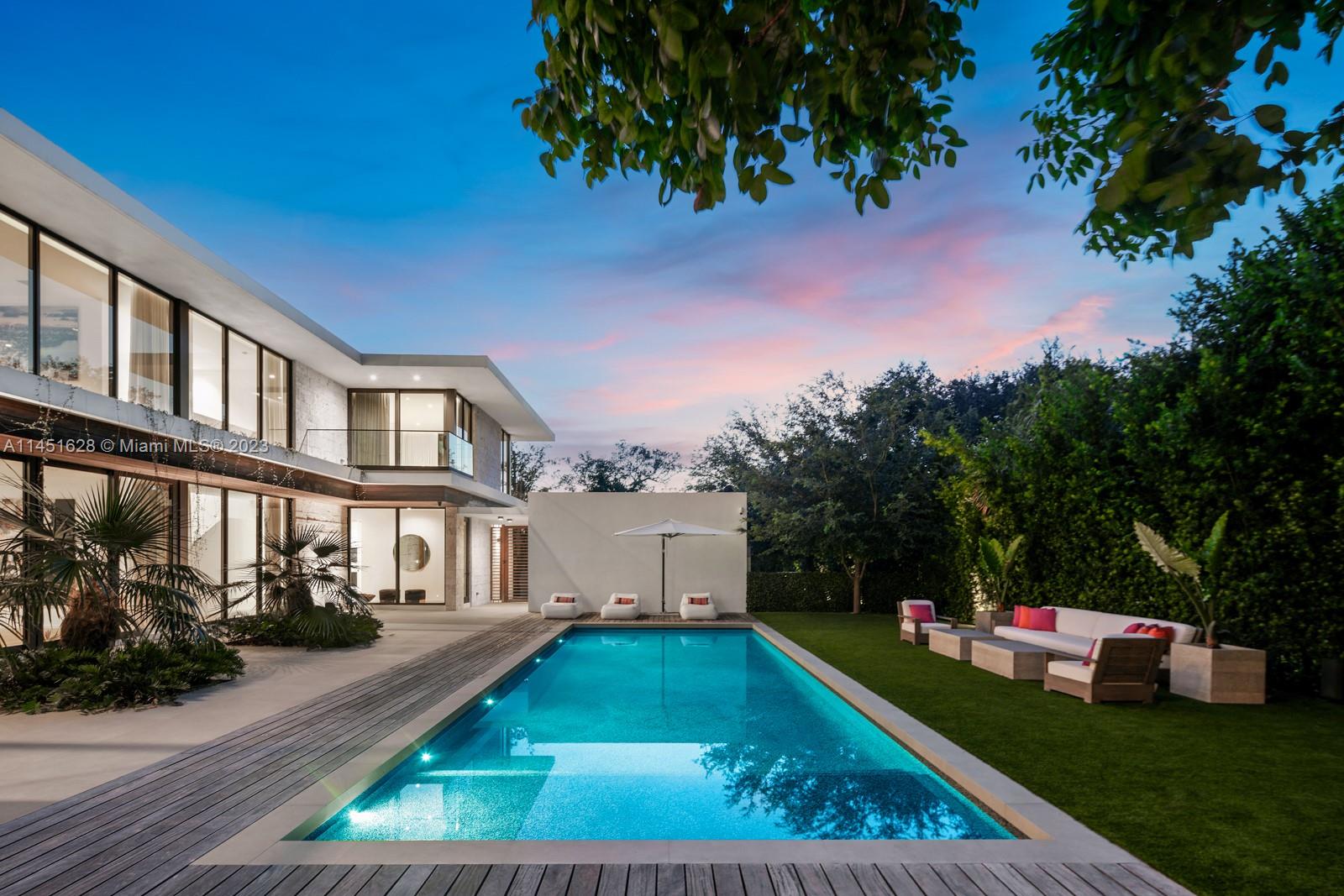 9261 School House Road Coral Gables, FL 33156 - Photo 57 of 65 a view of a house with a yard