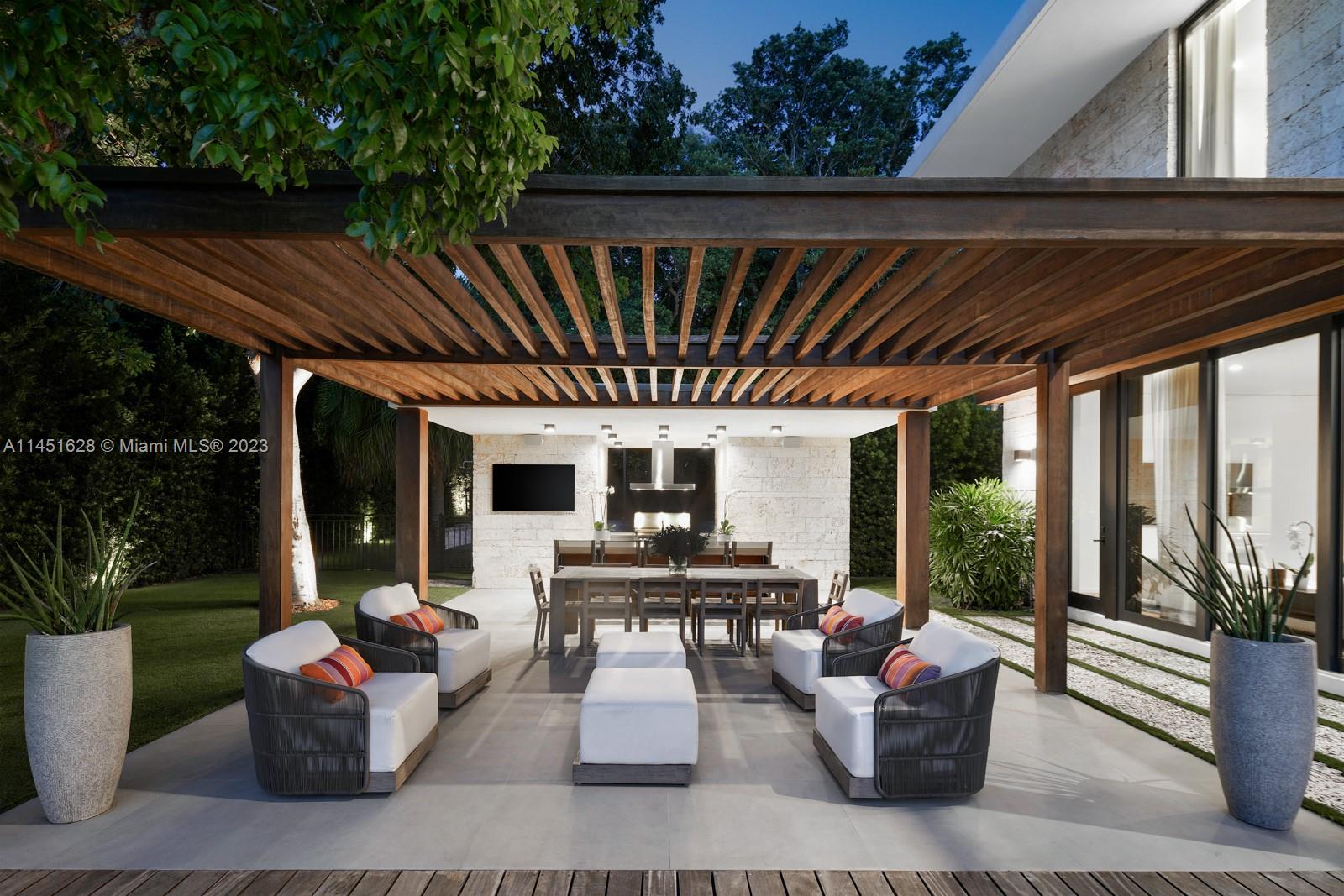 9261 School House Road Coral Gables, FL 33156 - Photo 61 of 65 a living room with patio furniture and a potted plants