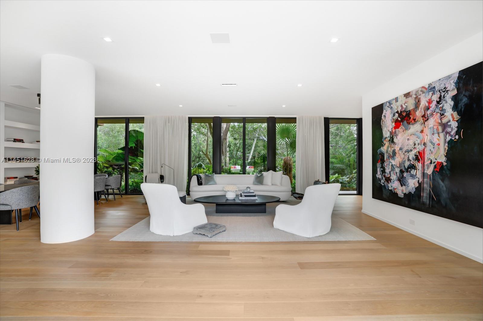 9261 School House Road Coral Gables, FL 33156 - Photo 7 of 65 a living room with furniture and large windows