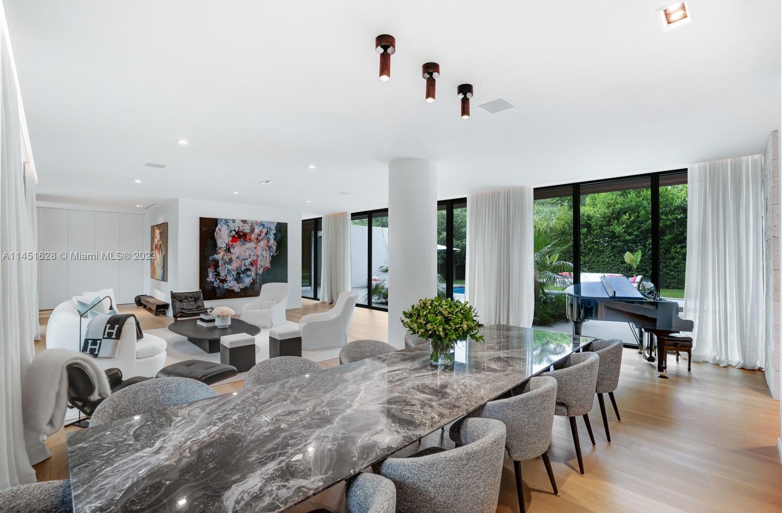 9261 School House Road Coral Gables, FL 33156 - Photo 9 of 65 a living room with furniture and a large window