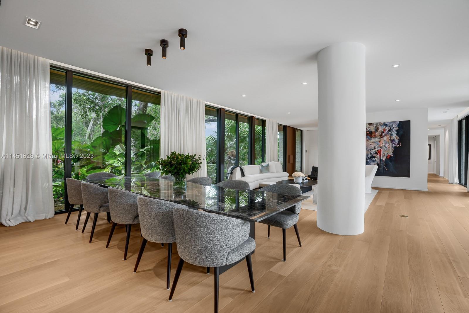 9261 School House Road Coral Gables, FL 33156 - Photo 10 of 65 a dining room with furniture and wooden floor