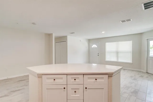 a view with cabinets and wooden floor