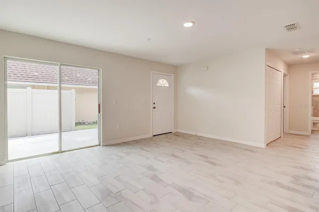 an empty room with sliding door