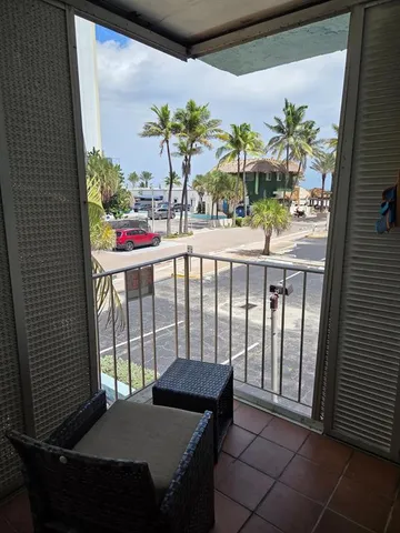a bedroom with furniture and a potted plant