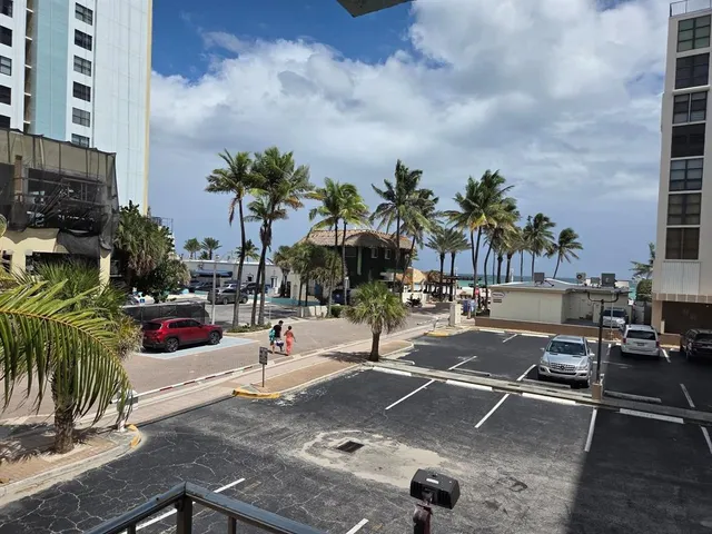 a living room with furniture tv and a window