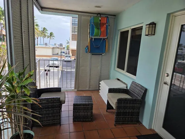 a view of street with palm trees