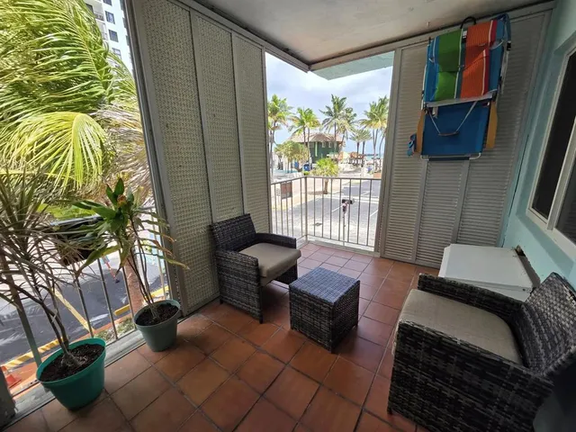 a living room with furniture a dining table and kitchen view
