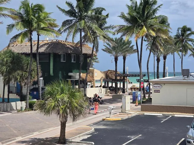 a view of a backyard with couches and a patio