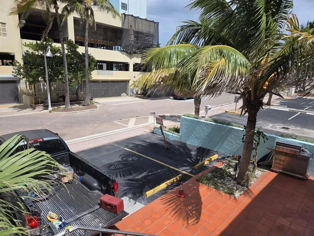 a view of a backyard with sitting area