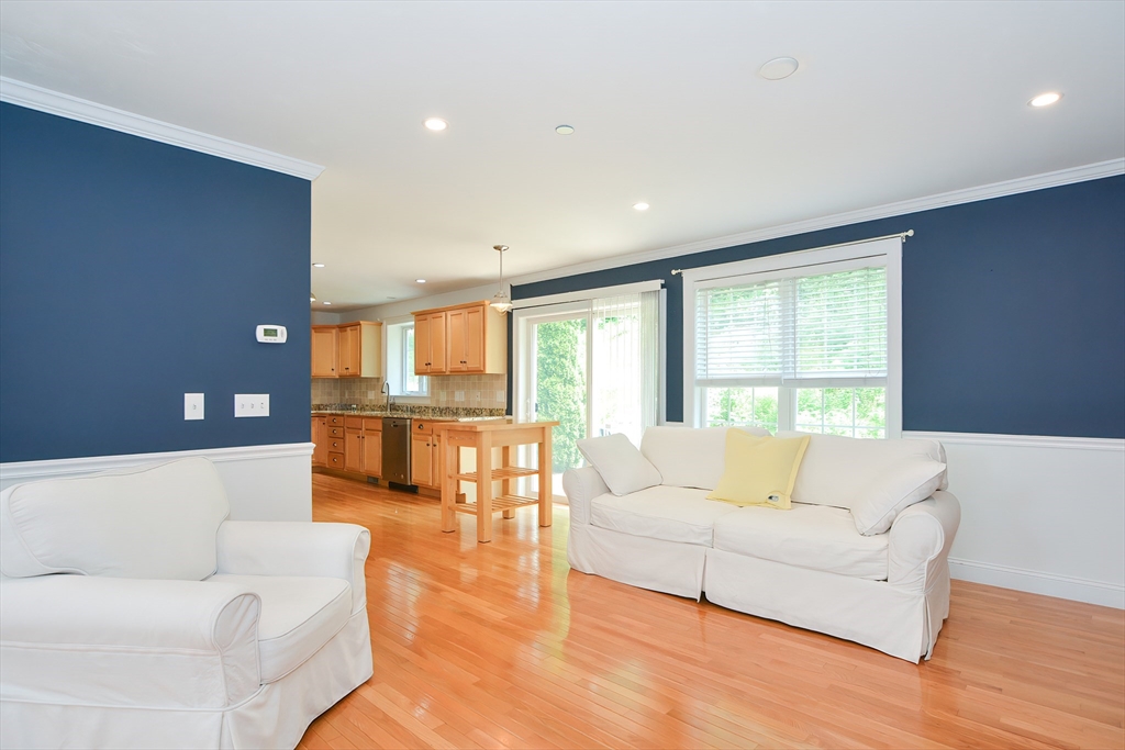 61 Providence Road, Unit 2 Grafton, MA 01519 - Photo 11 of 35 a living room with furniture and a large window