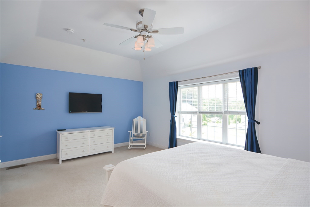 61 Providence Road, Unit 2 Grafton, MA 01519 - Photo 18 of 35 a bedroom with a bed and a window