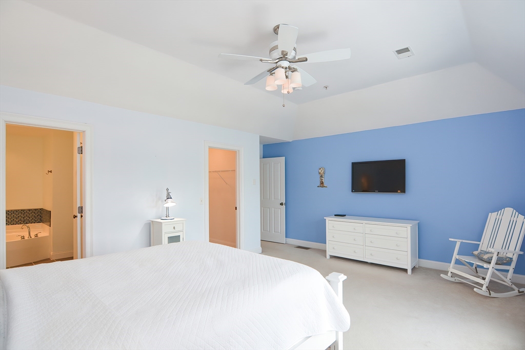 61 Providence Road, Unit 2 Grafton, MA 01519 - Photo 20 of 35 a bedroom with a bed and a chandelier