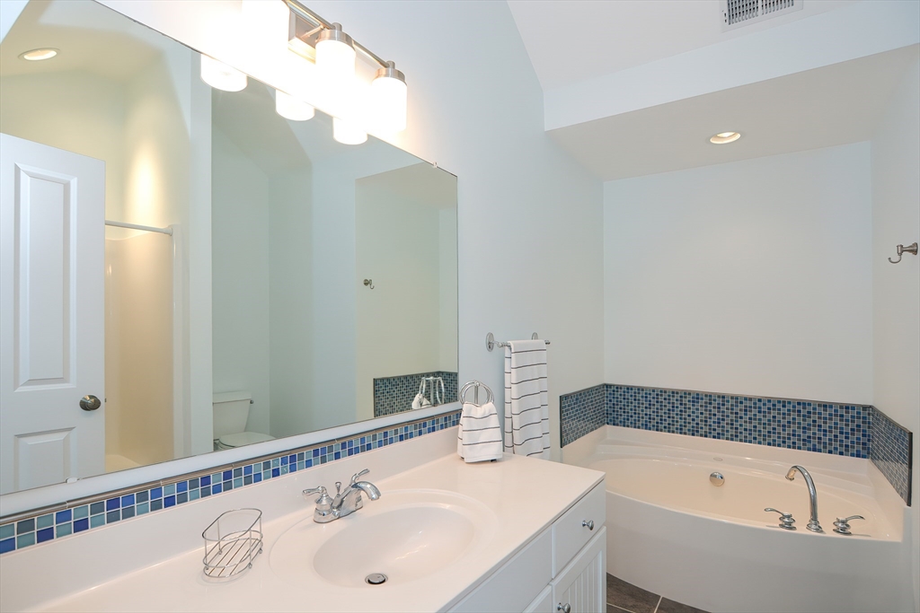 61 Providence Road, Unit 2 Grafton, MA 01519 - Photo 23 of 35 a bathroom with a bathtub and a sink