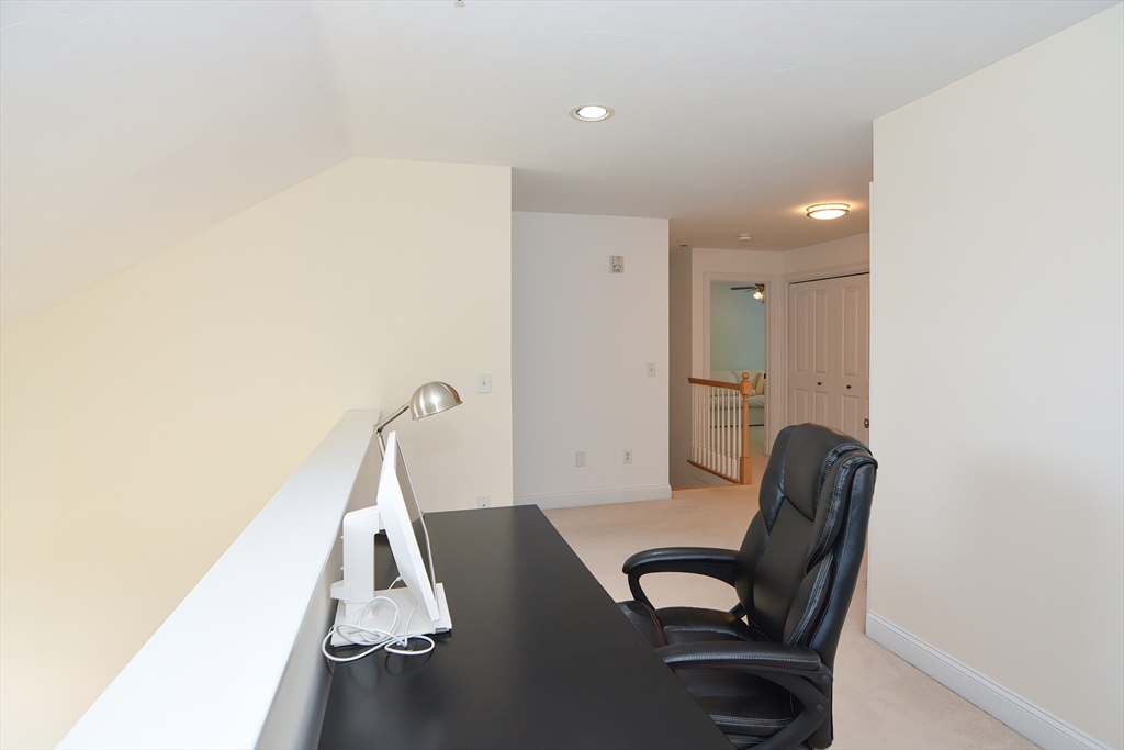 61 Providence Road, Unit 2 Grafton, MA 01519 - Photo 26 of 35 a view of a hallway with workspace and a couch