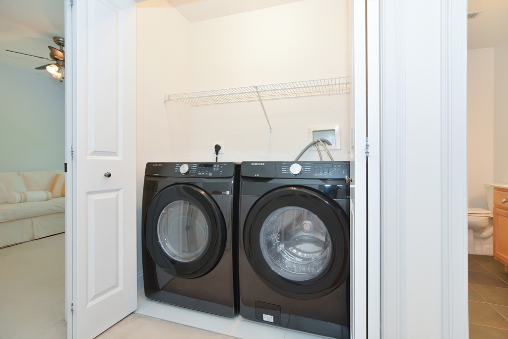 61 Providence Road, Unit 2 Grafton, MA 01519 - Photo 27 of 35 a utility room with dryer and washer