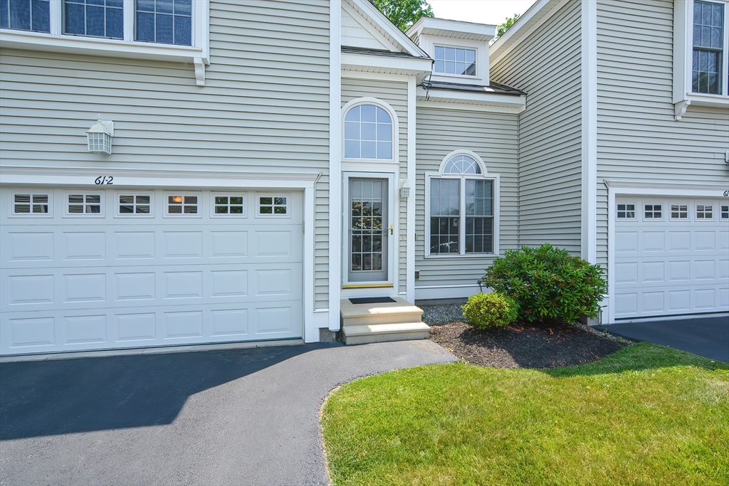 61 Providence Road, Unit 2 Grafton, MA 01519 - Photo 3 of 35 a front view of a house with a yard