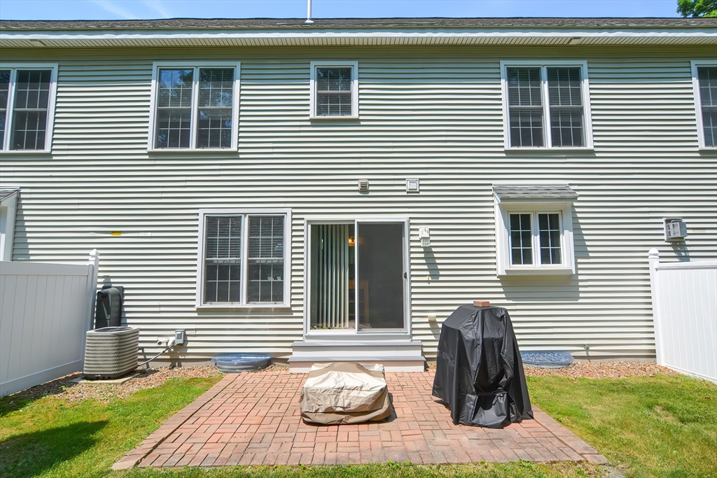 61 Providence Road, Unit 2 Grafton, MA 01519 - Photo 4 of 35 a front view of a house with seating space