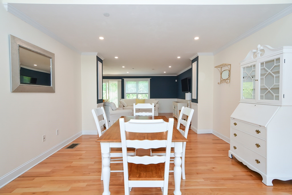 61 Providence Road, Unit 2 Grafton, MA 01519 - Photo 8 of 35 a view of a dining room with furniture and wooden floor