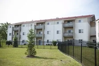 a view of a house with backyard and balcony