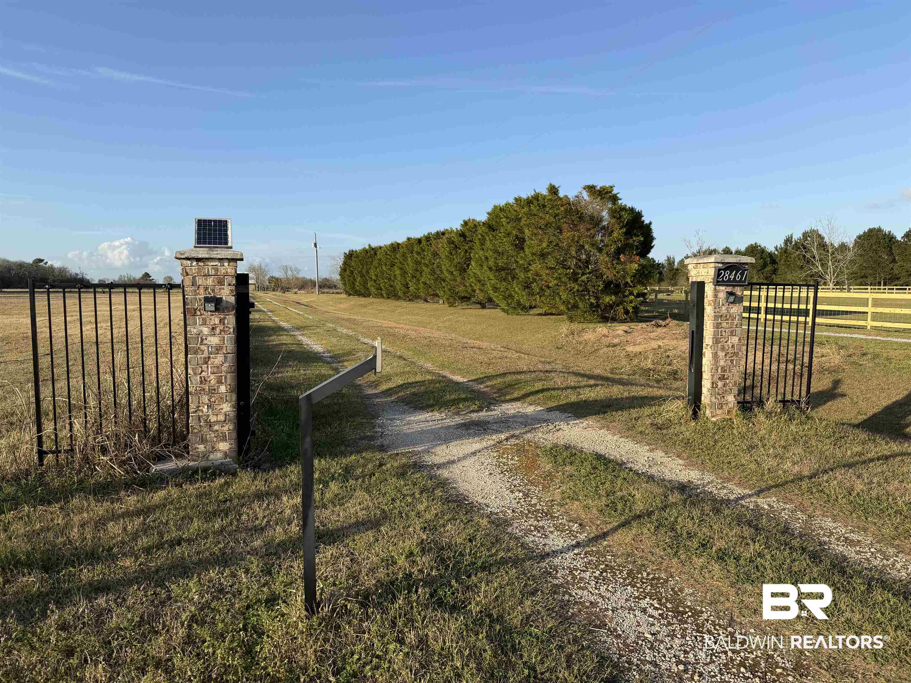 28467 Gardner Road Elberta, AL 36530 - Photo 10 of 10 View of dirt / gravel driveway with a view of countryside and a gate