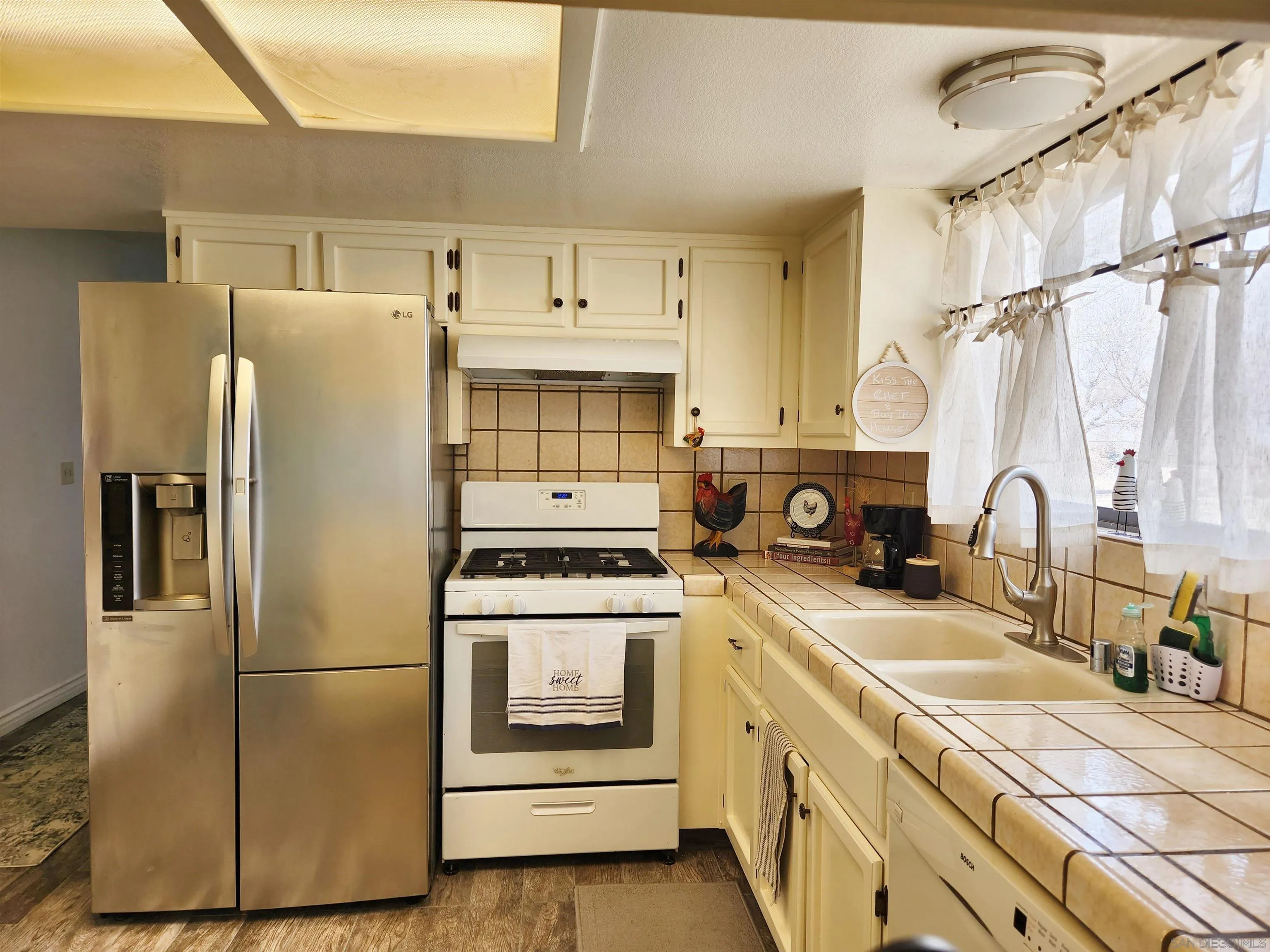 3628 Alene Avenue Ridgecrest, CA 93555 - Photo 15 of 46 a kitchen with a stove cabinets and a refrigerator