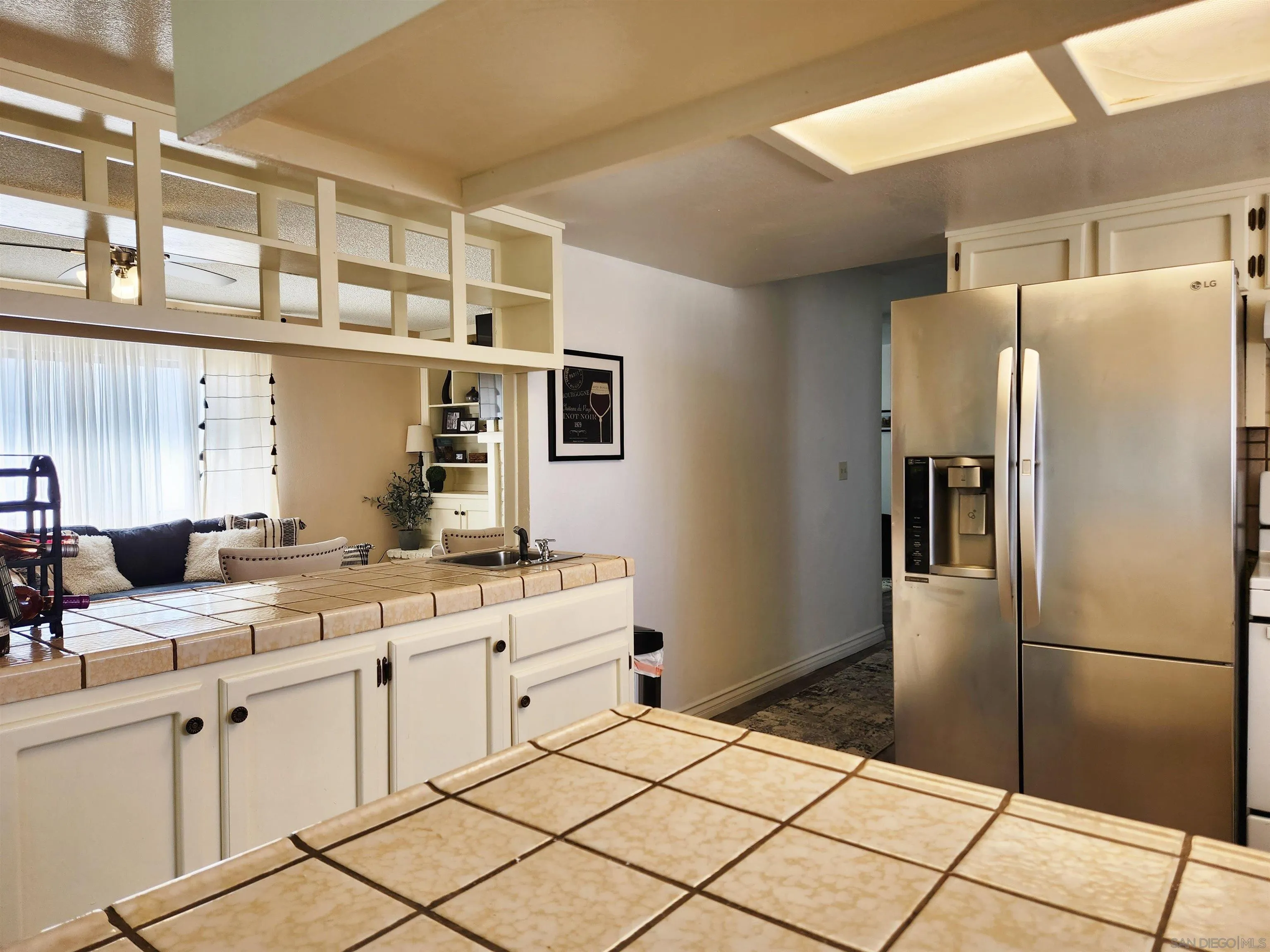 3628 Alene Avenue Ridgecrest, CA 93555 - Photo 16 of 46 a kitchen with stainless steel appliances a refrigerator sink and cabinets