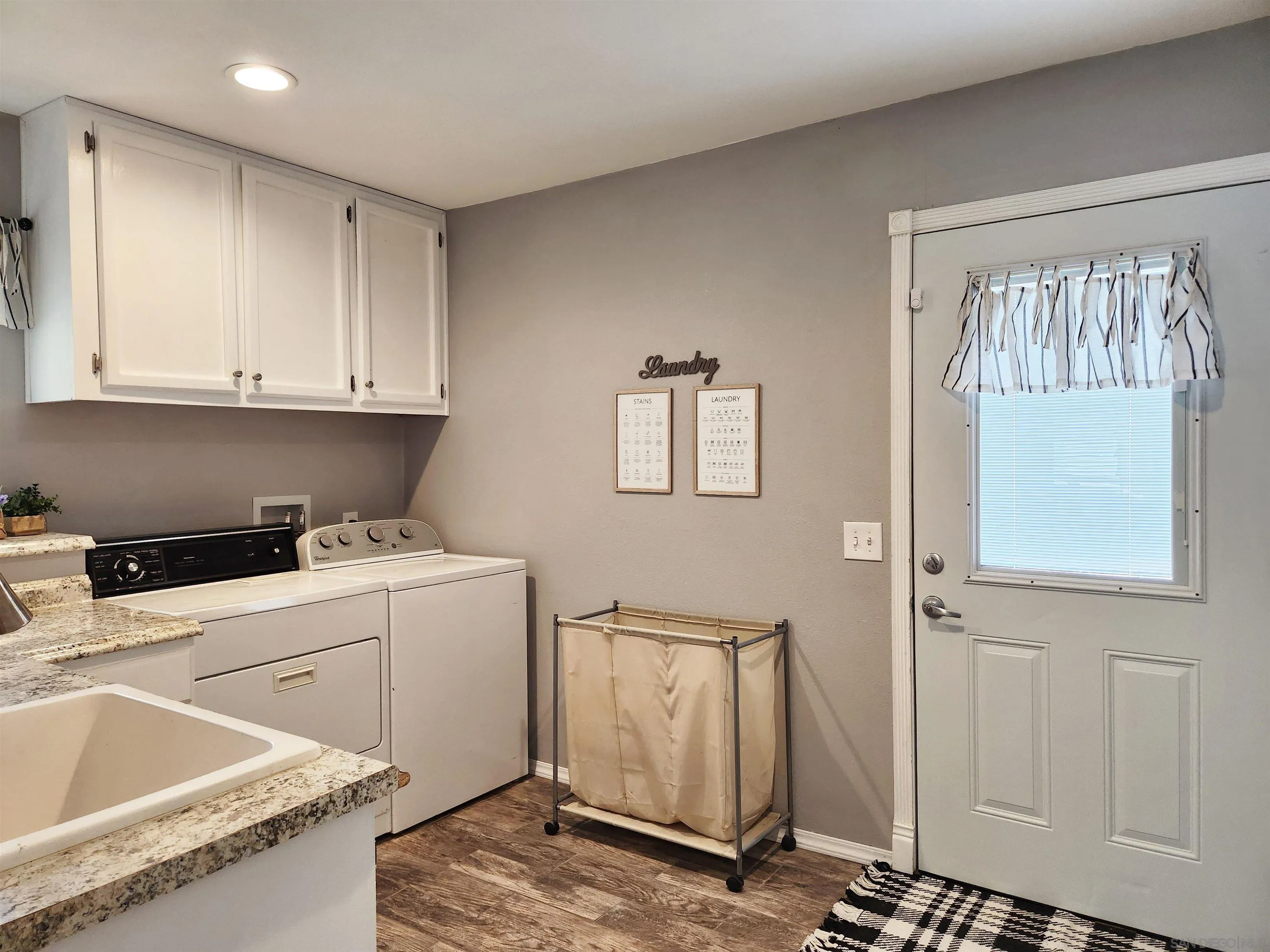 3628 Alene Avenue Ridgecrest, CA 93555 - Photo 18 of 46 a view of a kitchen with fridge and wooden floor