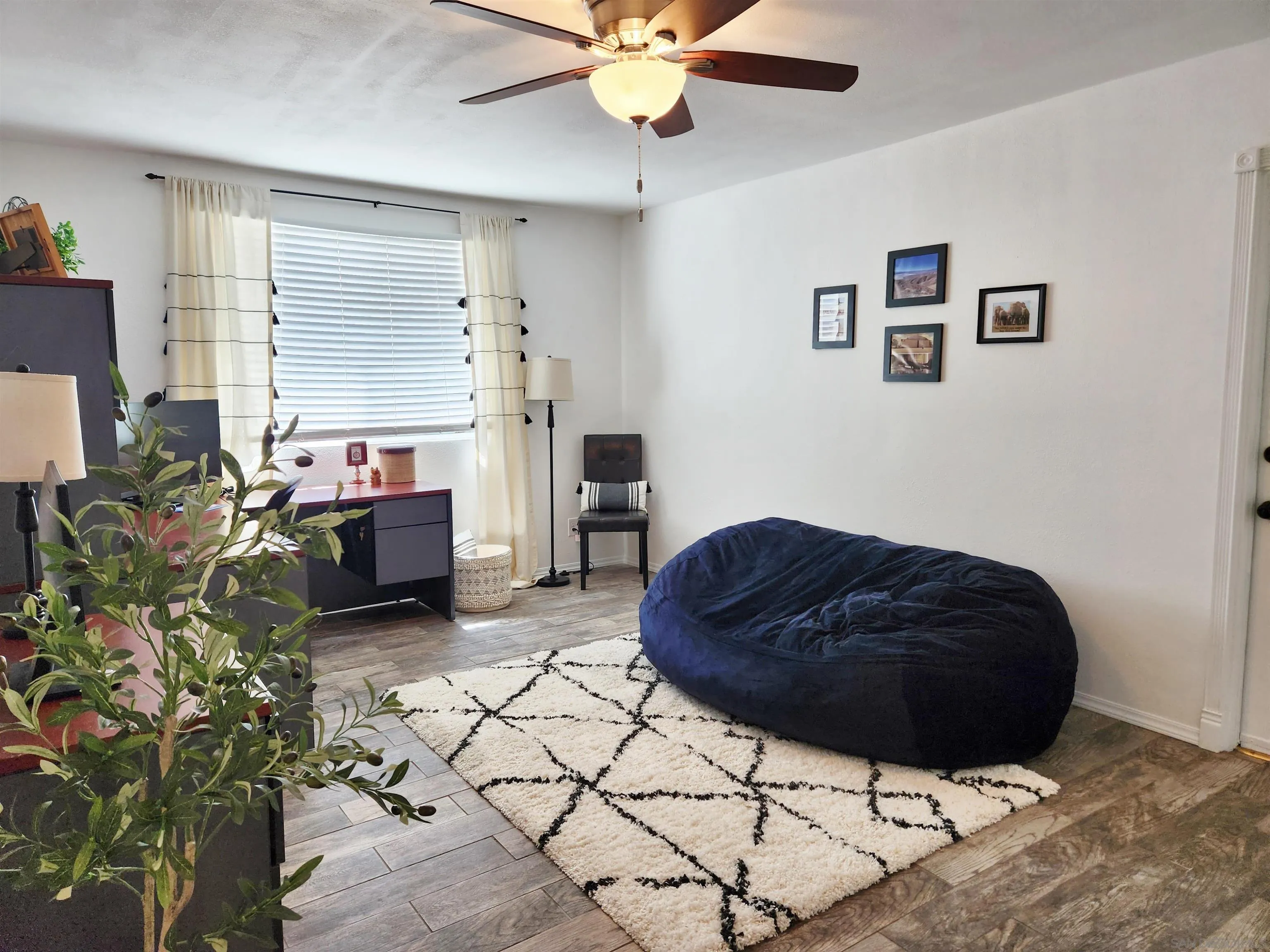 3628 Alene Avenue Ridgecrest, CA 93555 - Photo 20 of 46 a living room with furniture and a fireplace