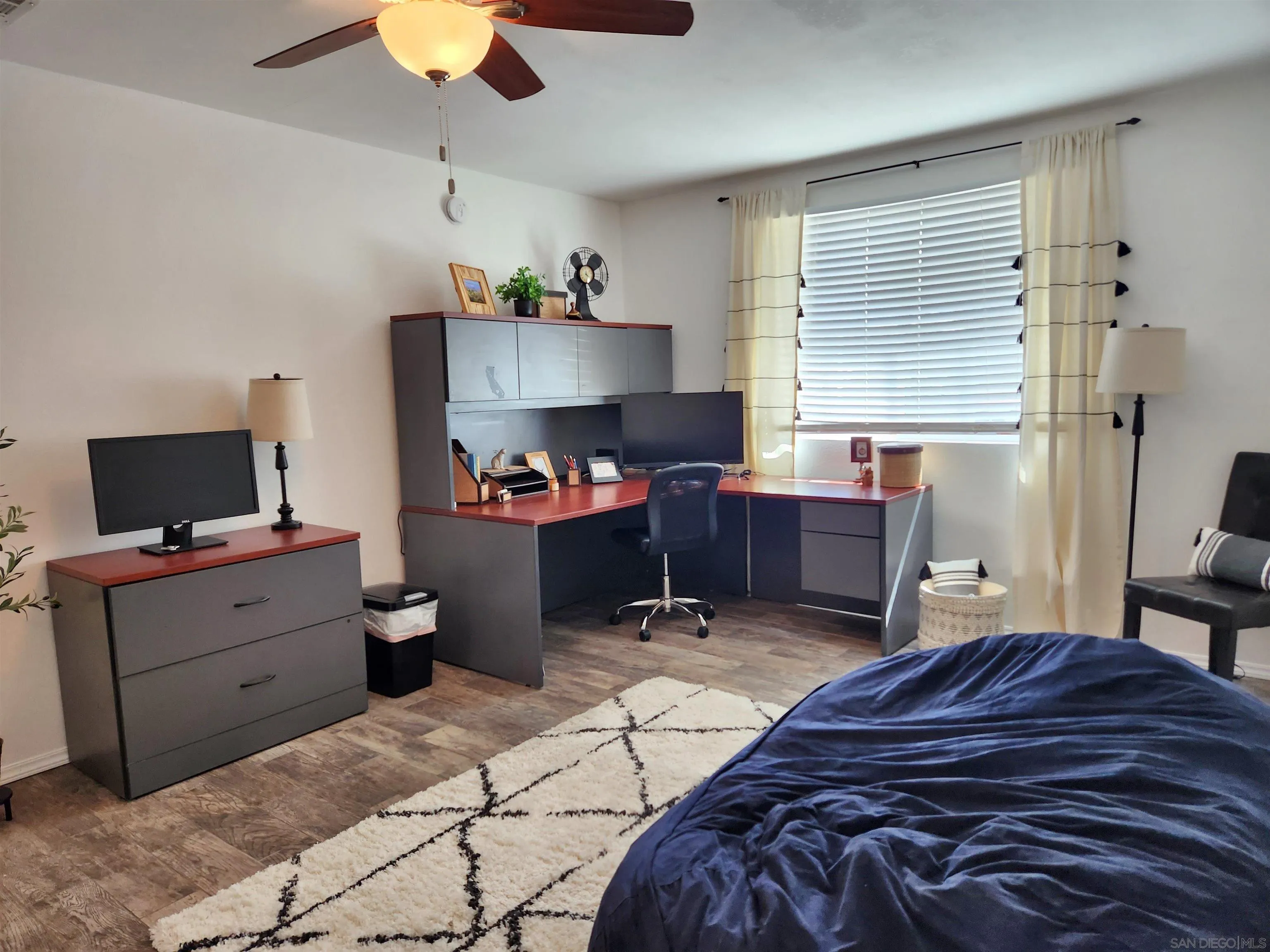 3628 Alene Avenue Ridgecrest, CA 93555 - Photo 21 of 46 a bed room with a bed and a television