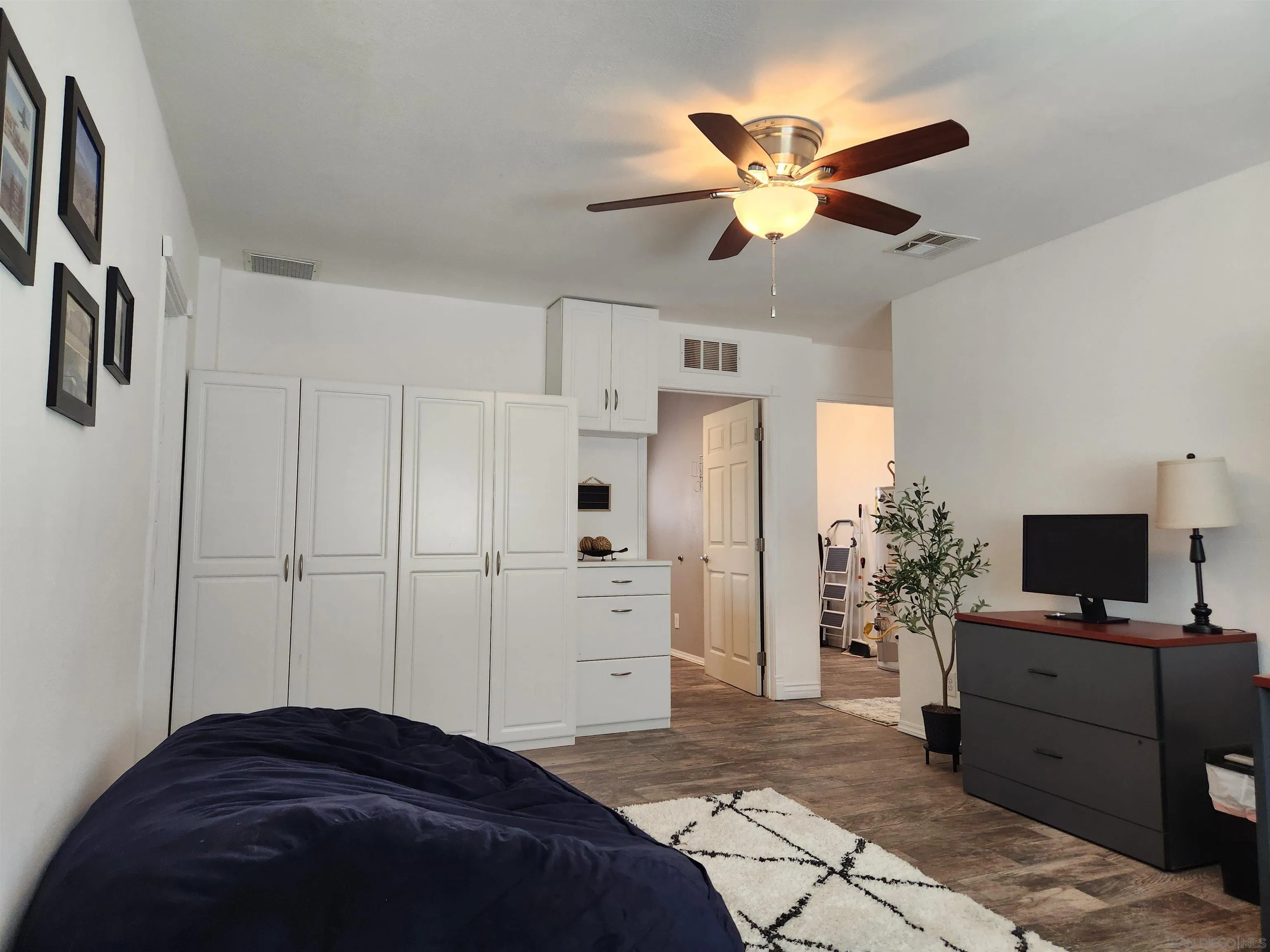 3628 Alene Avenue Ridgecrest, CA 93555 - Photo 22 of 46 a bedroom with a bed and a ceiling fan