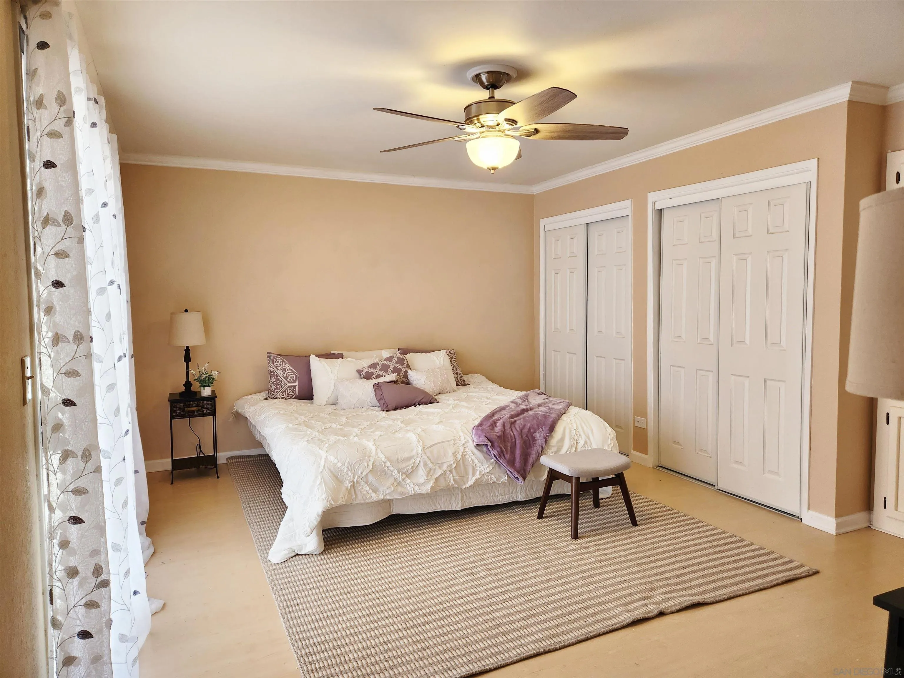3628 Alene Avenue Ridgecrest, CA 93555 - Photo 25 of 46 a bedroom with a bed and a chandelier