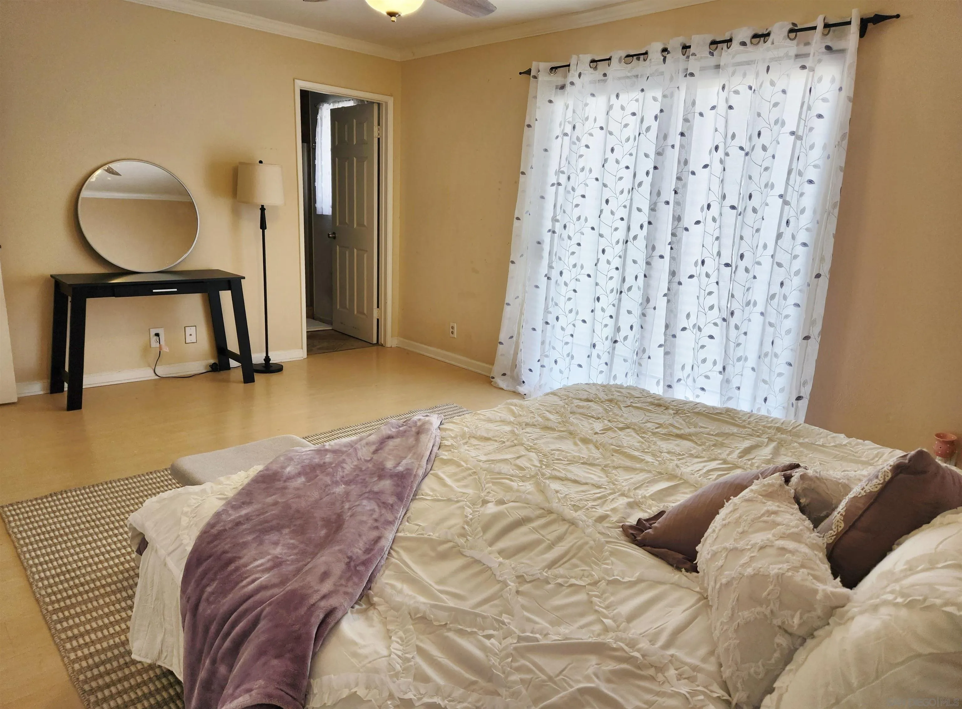 3628 Alene Avenue Ridgecrest, CA 93555 - Photo 27 of 46 a bedroom with a bed and a mirror