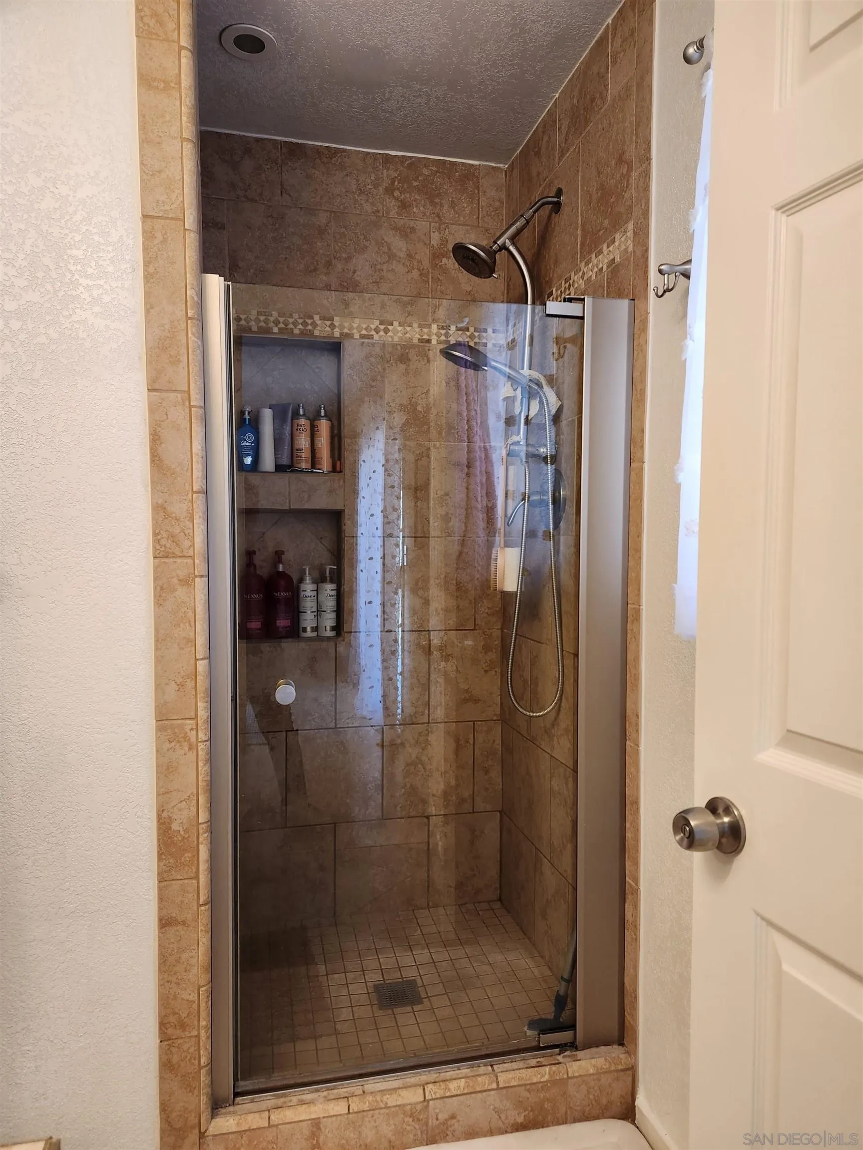 3628 Alene Avenue Ridgecrest, CA 93555 - Photo 29 of 46 a bathroom with a glass shower door