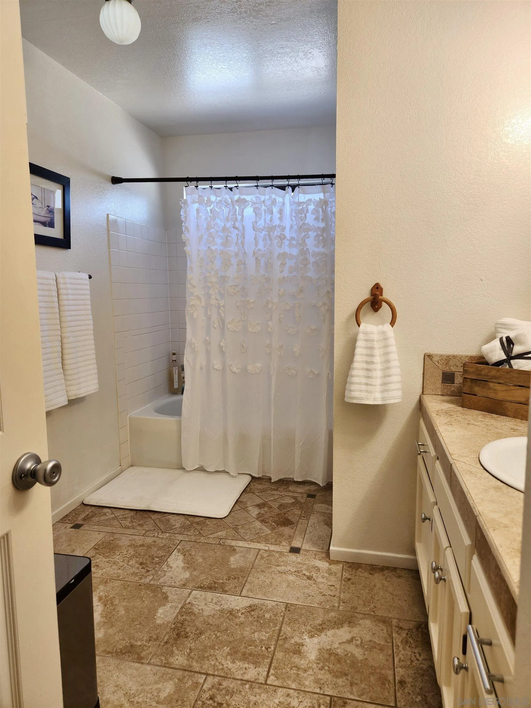3628 Alene Avenue Ridgecrest, CA 93555 - Photo 36 of 46 a bathroom with a shower and a sink