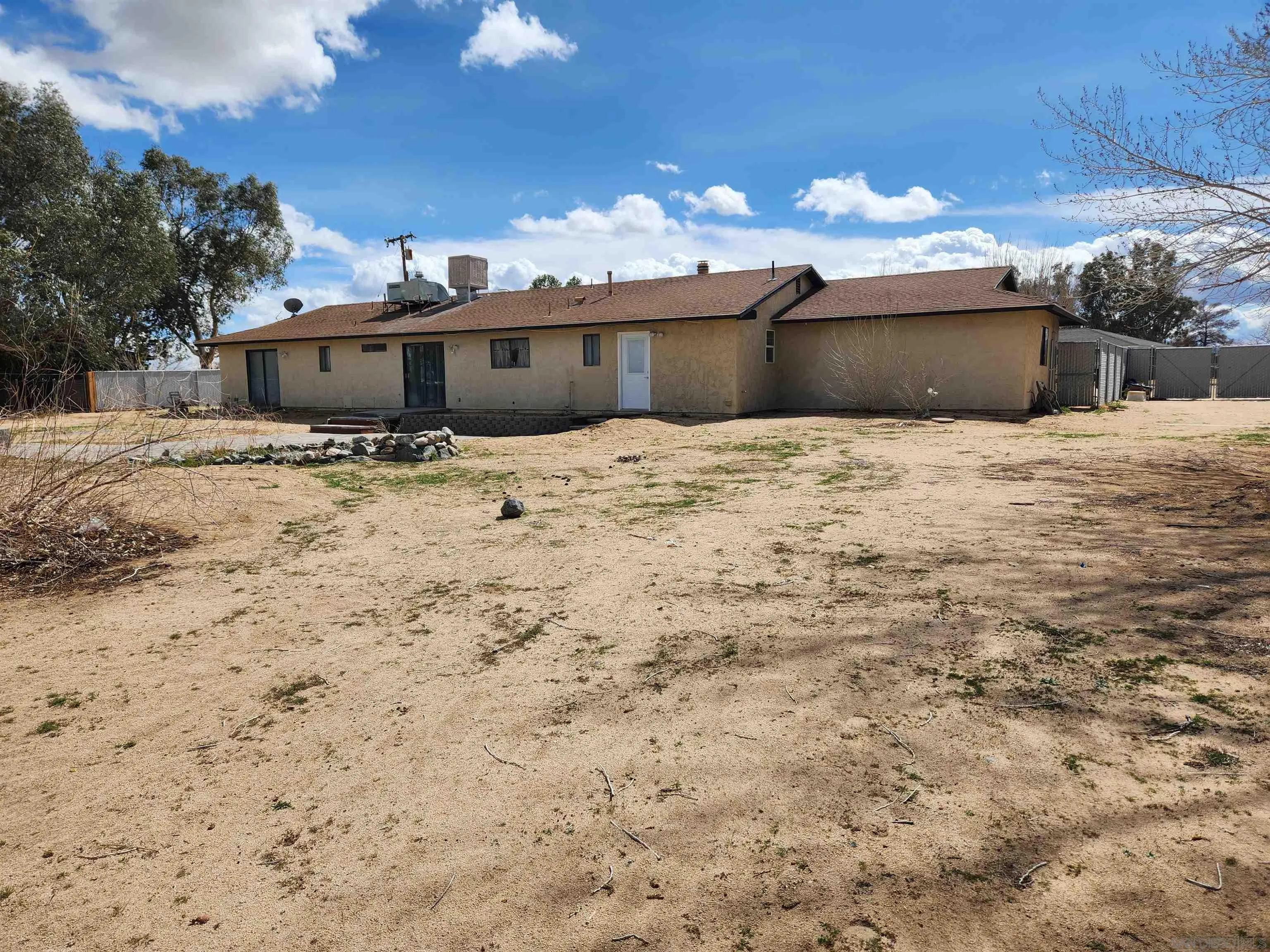 3628 Alene Avenue Ridgecrest, CA 93555 - Photo 43 of 46 a view of a house with a yard