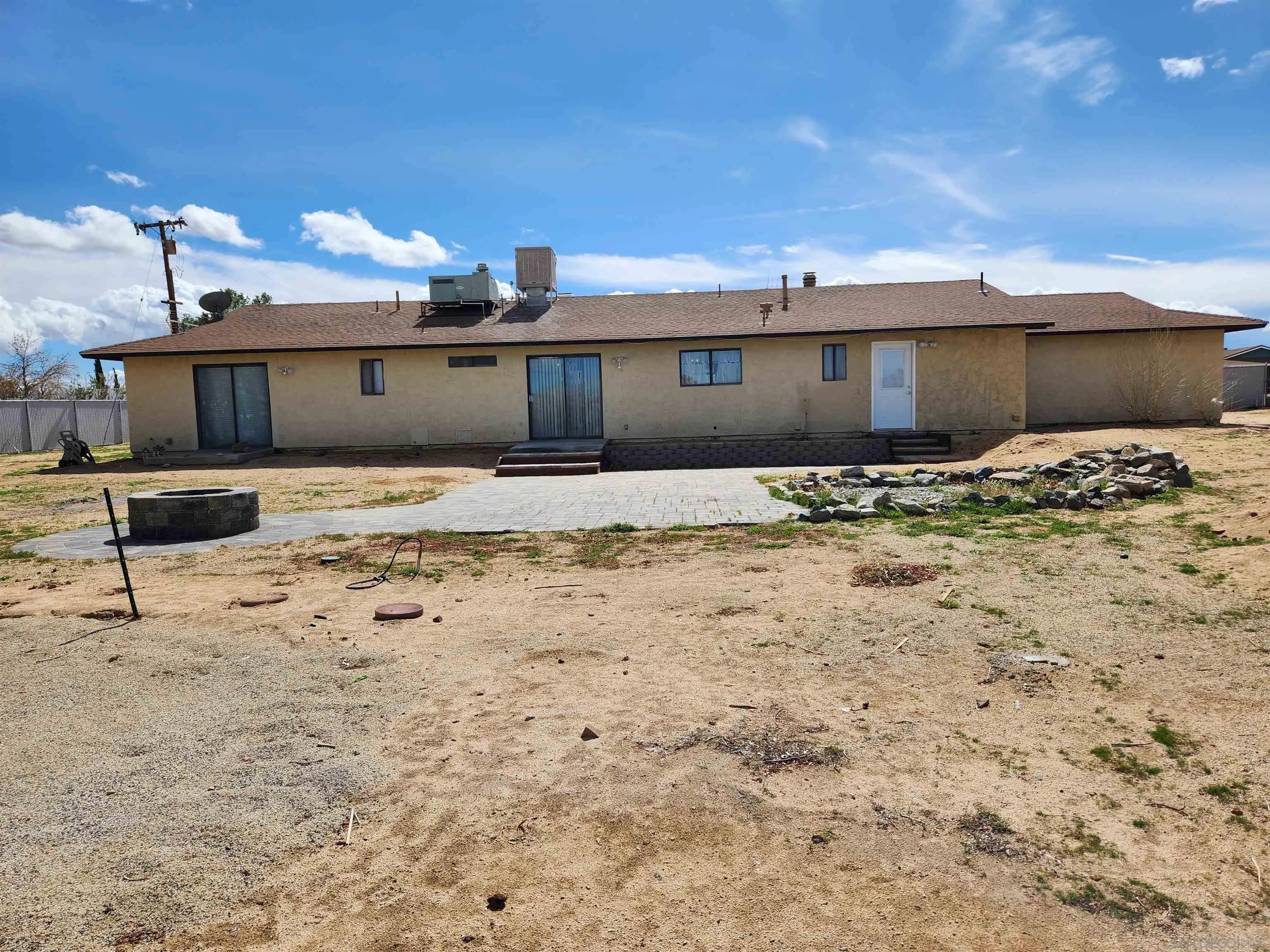 3628 Alene Avenue Ridgecrest, CA 93555 - Photo 45 of 46 a view of a house with snow on the wall