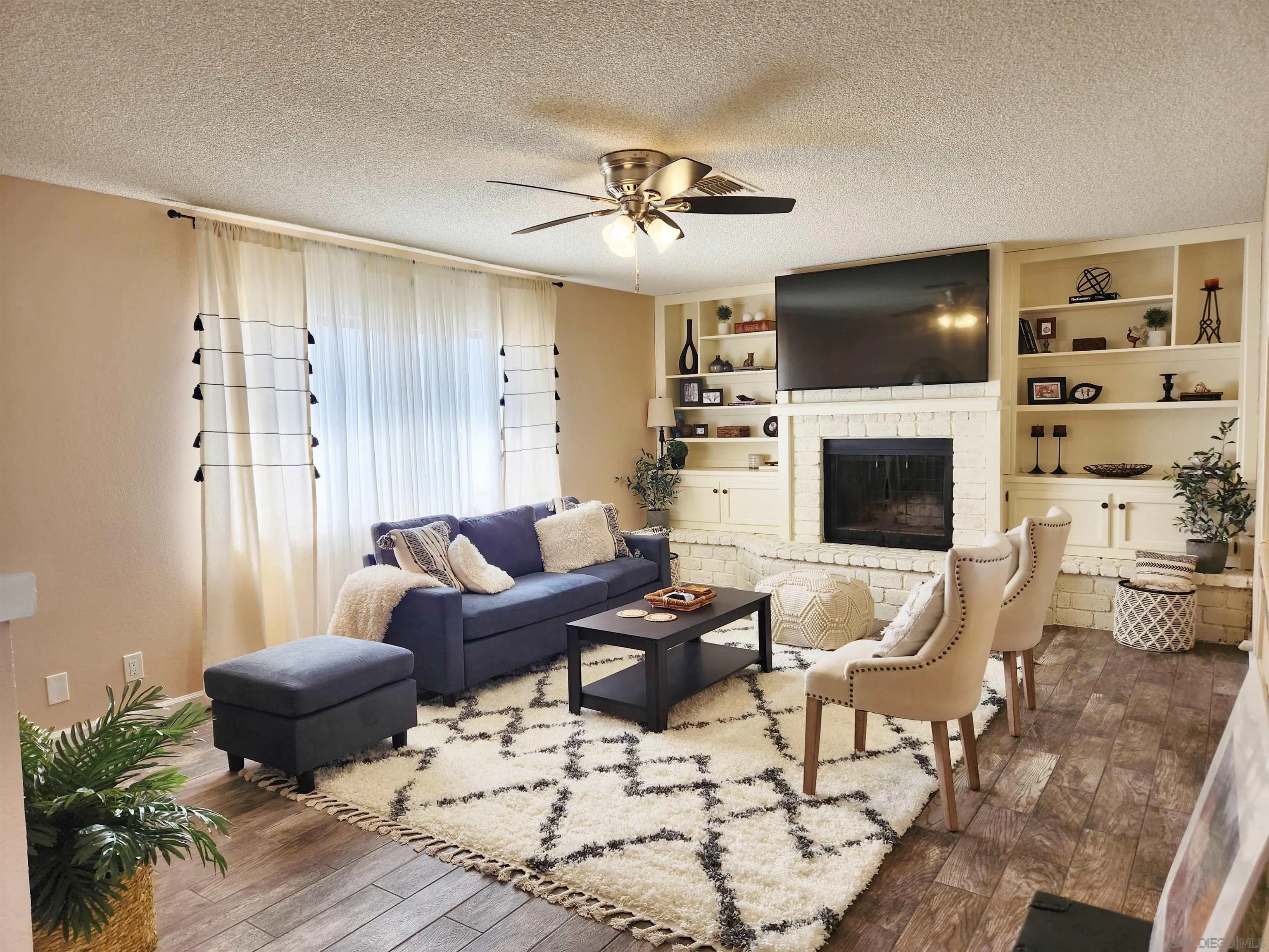 3628 Alene Avenue Ridgecrest, CA 93555 - Photo 7 of 46 a living room with furniture and a flat screen tv