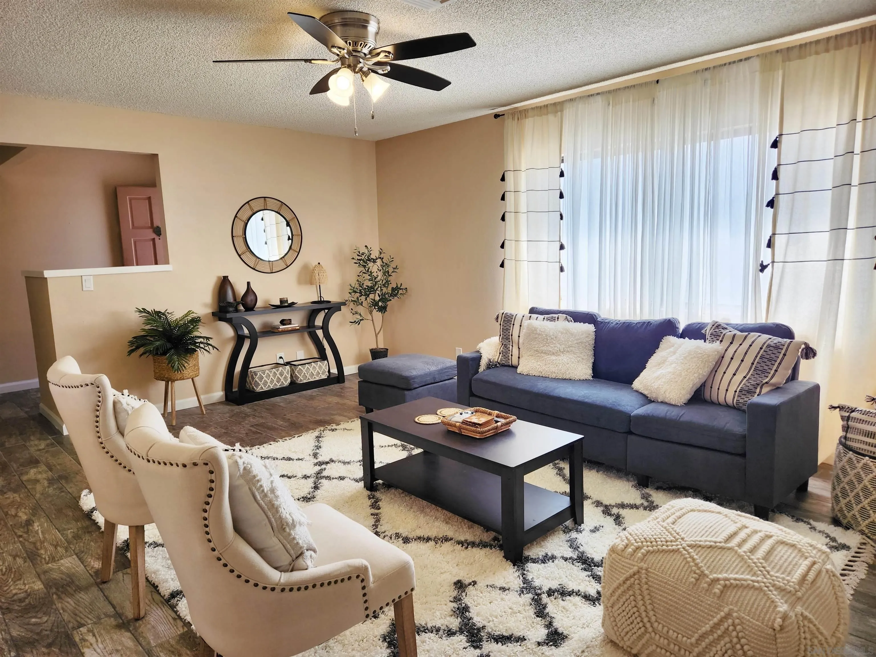 3628 Alene Avenue Ridgecrest, CA 93555 - Photo 8 of 46 a living room with furniture a rug and a window