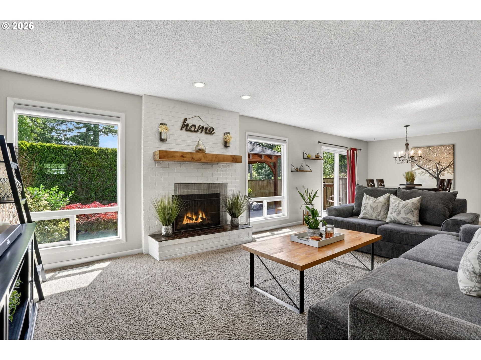 1776 Southeast 114th Place Portland, OR 97216 - Photo 25 of 47 a living room with furniture and a fireplace