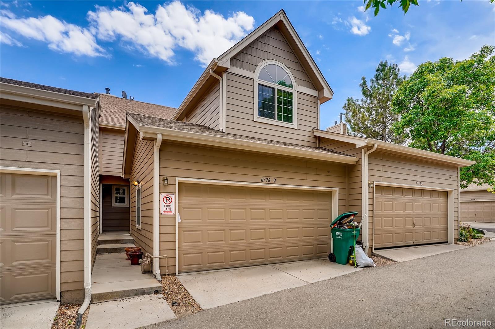a front view of a house with a garage