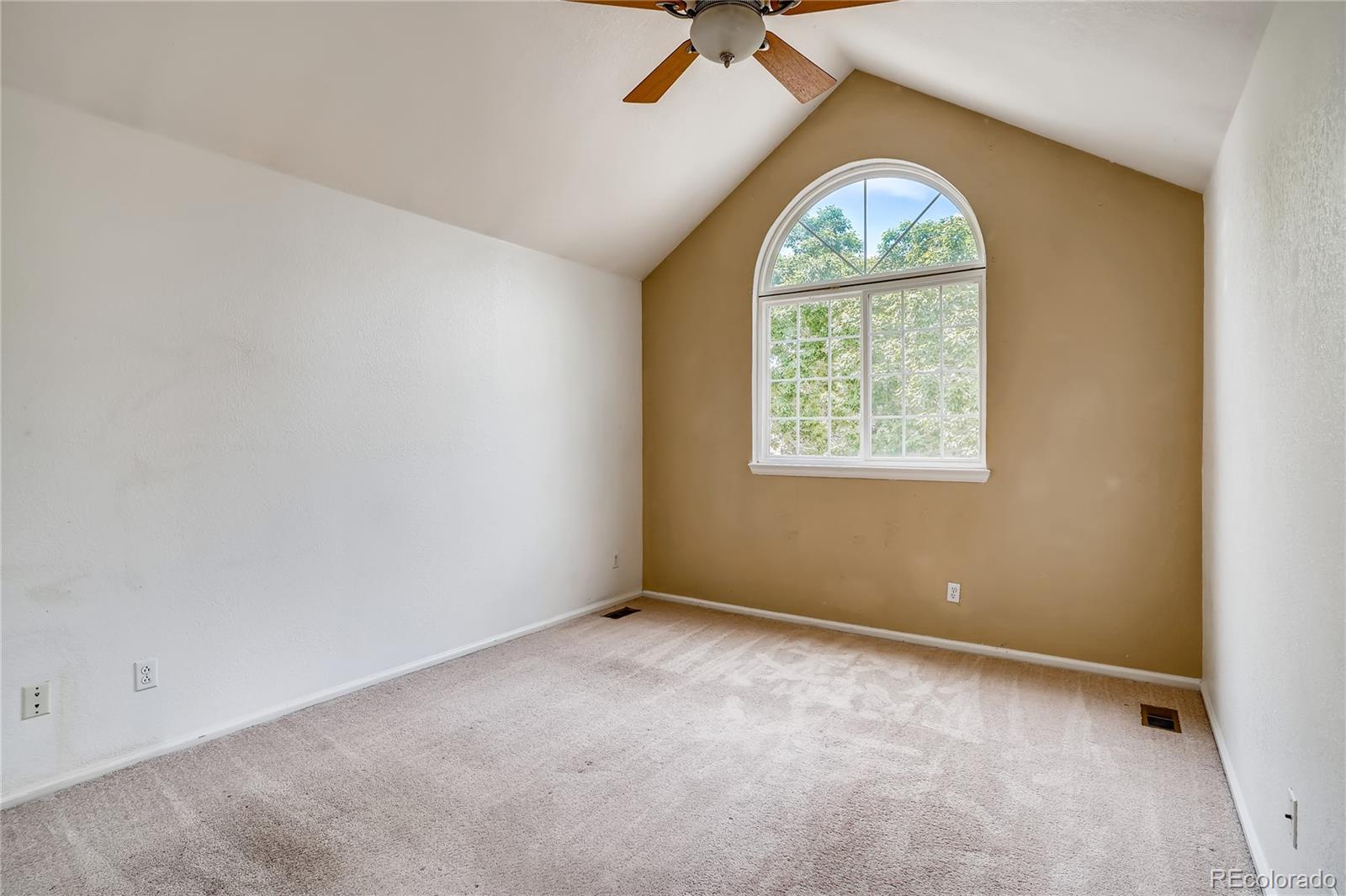 6778 Zenobia Loop, Unit 2 Westminster, CO 80030 - Photo 7 of 13 an empty room with a window