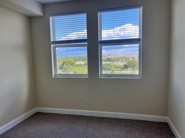 1660 Renaissance Commons Boulevard, Unit 2608 Boynton Beach, FL 33426 - Photo 12 of 31 an empty room with windows