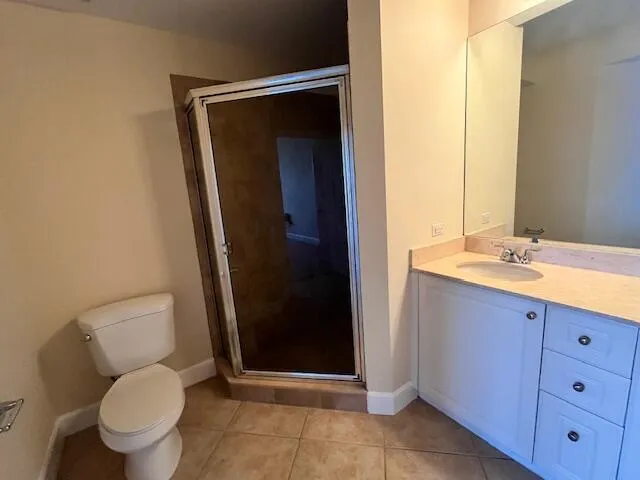 a bathroom with a toilet a sink and a mirror